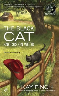 The black cat knocks on wood /