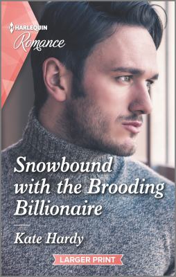 Snowbound with the brooding billionaire /