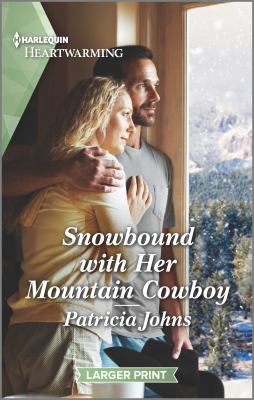 Snowbound with her mountain cowboy /