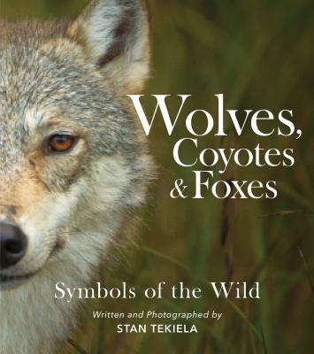 Wolves, coyotes & foxes : symbols of the wild /